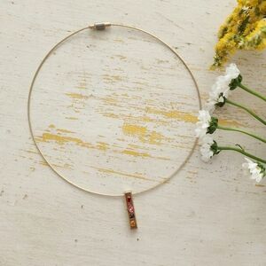 Elegant Gold Pendant Necklace with Red and Orange Accents